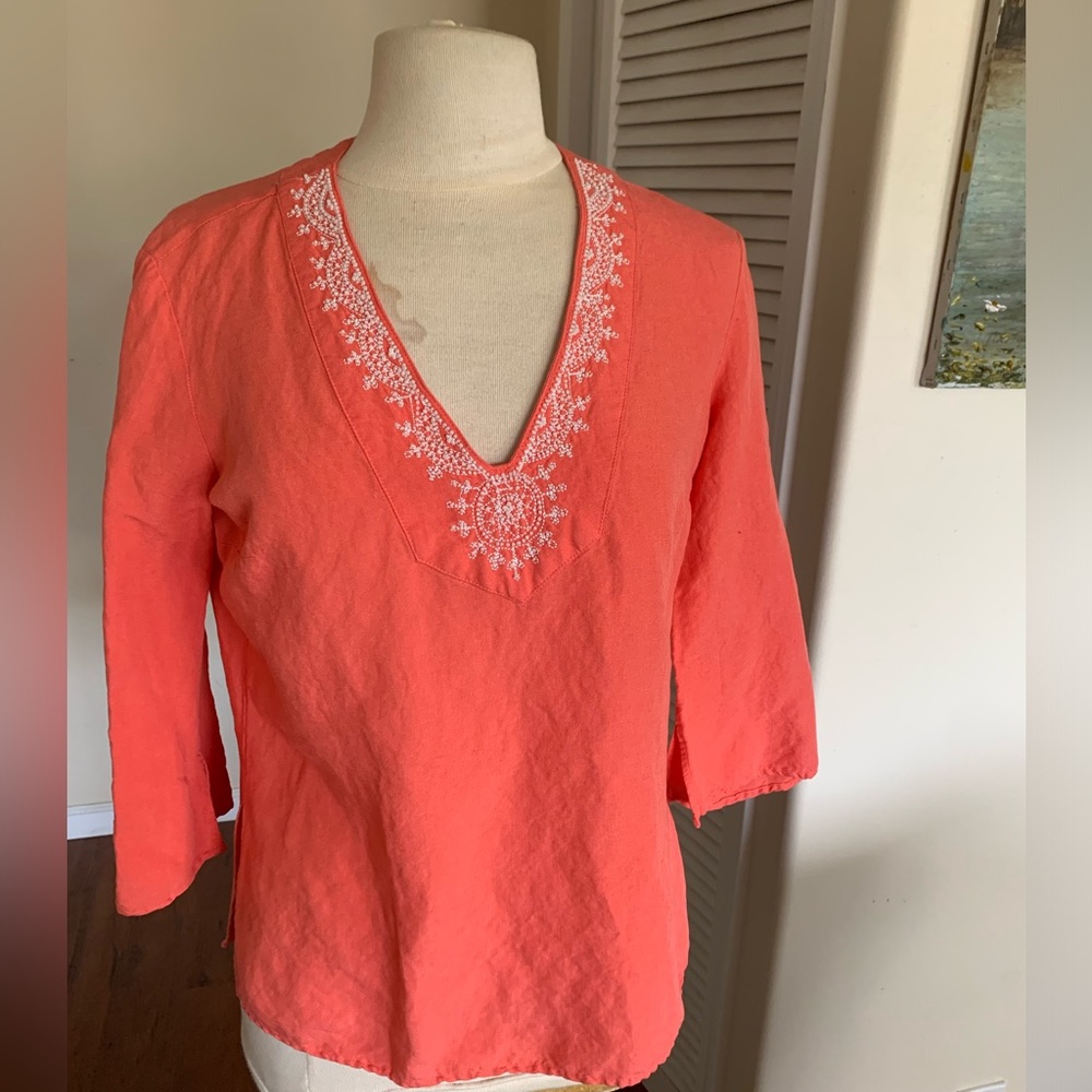 Great, little orange V-Neck with faux pearl beading around the neck.